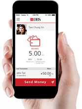 PayLah in DBS marketing of the era: the wallet open on a phone held in a hand
